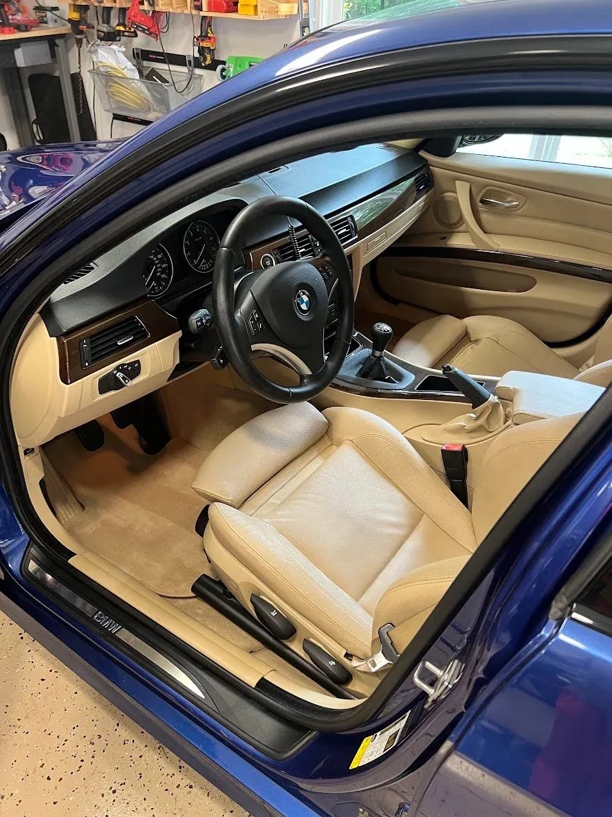 Blue BMW interior with beige leather after detailing