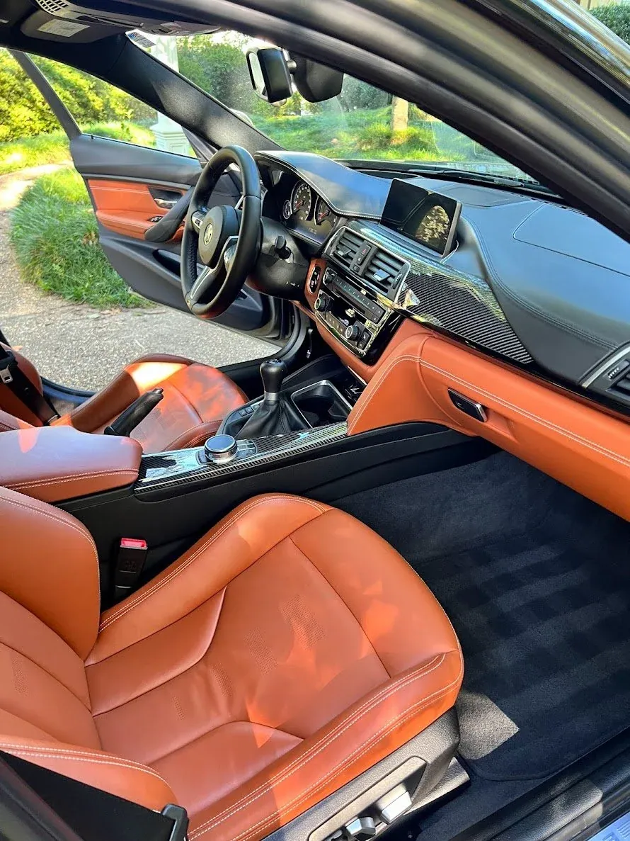 Brown leather seats after deep cleaning and conditioning