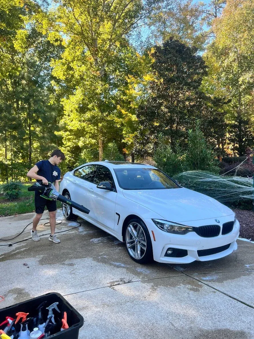 Hand washing a vehicle during a mobile detail in Raleigh