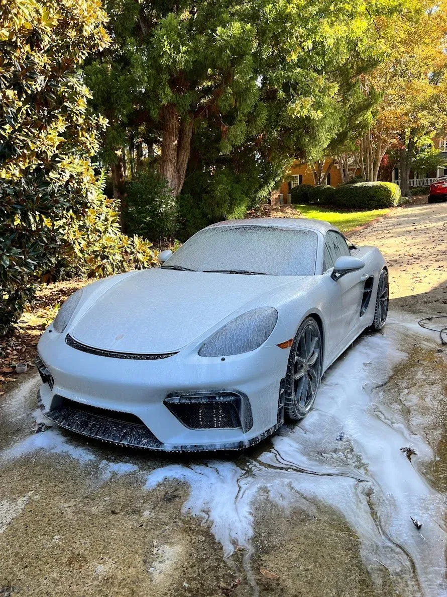 White sports car during a foam hand wash