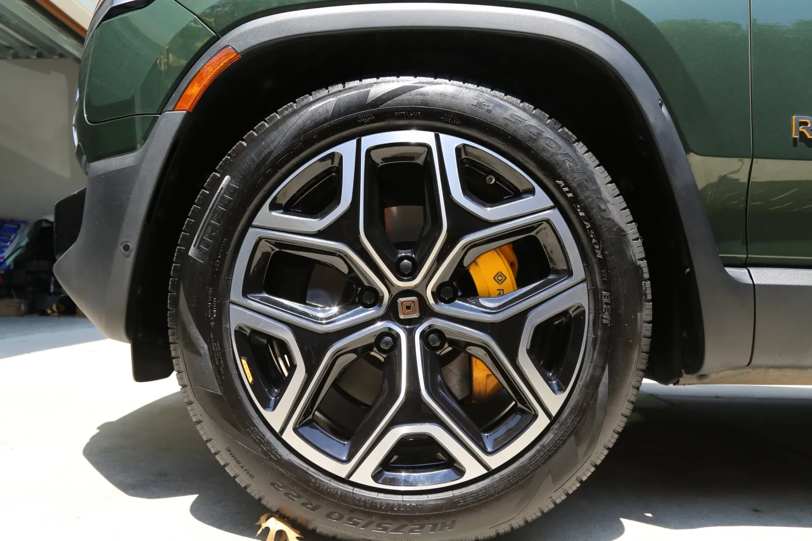 Wheel and yellow brake caliper after ceramic coating